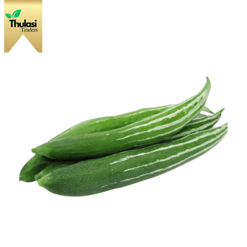 Fresh Snake Gourd (Pudalankai) - Locally sourced vegetable by Thulasi Traders. Perfect for enhancing culinary creations with mild and nutritious goodness.